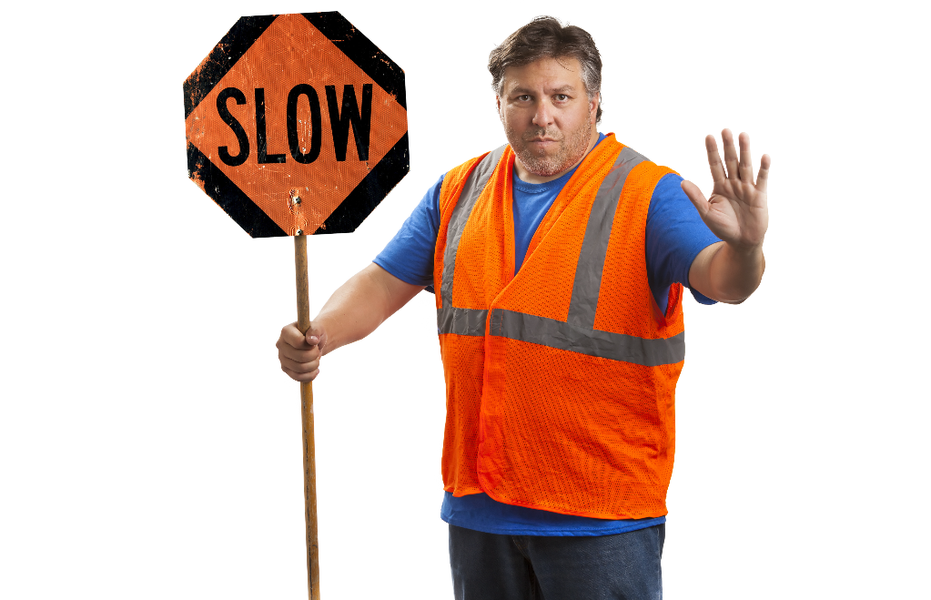 man with a slow sign