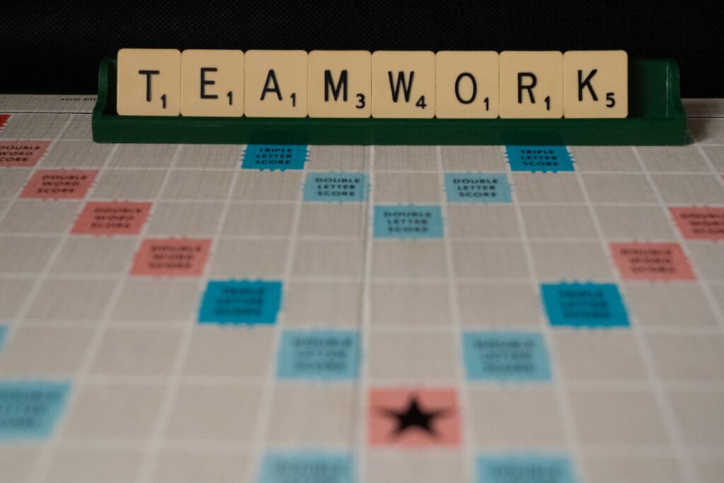 scrabble board spelling Teamwork