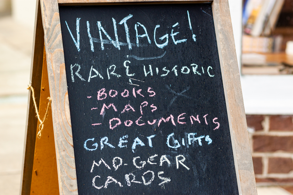 sidewalk sign promoting rare items for sale